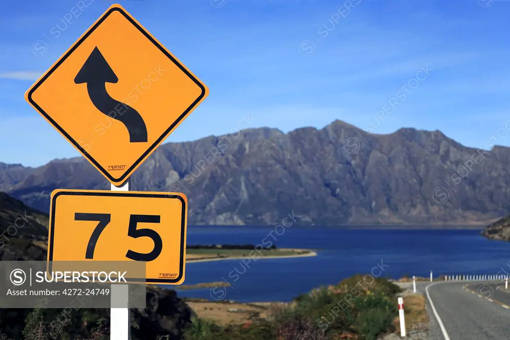 New Zealand, Cantebury & West Coast, Lake Hawea. The road and speed limit sign down to Lake Hawea on highway 6 to Wanaka