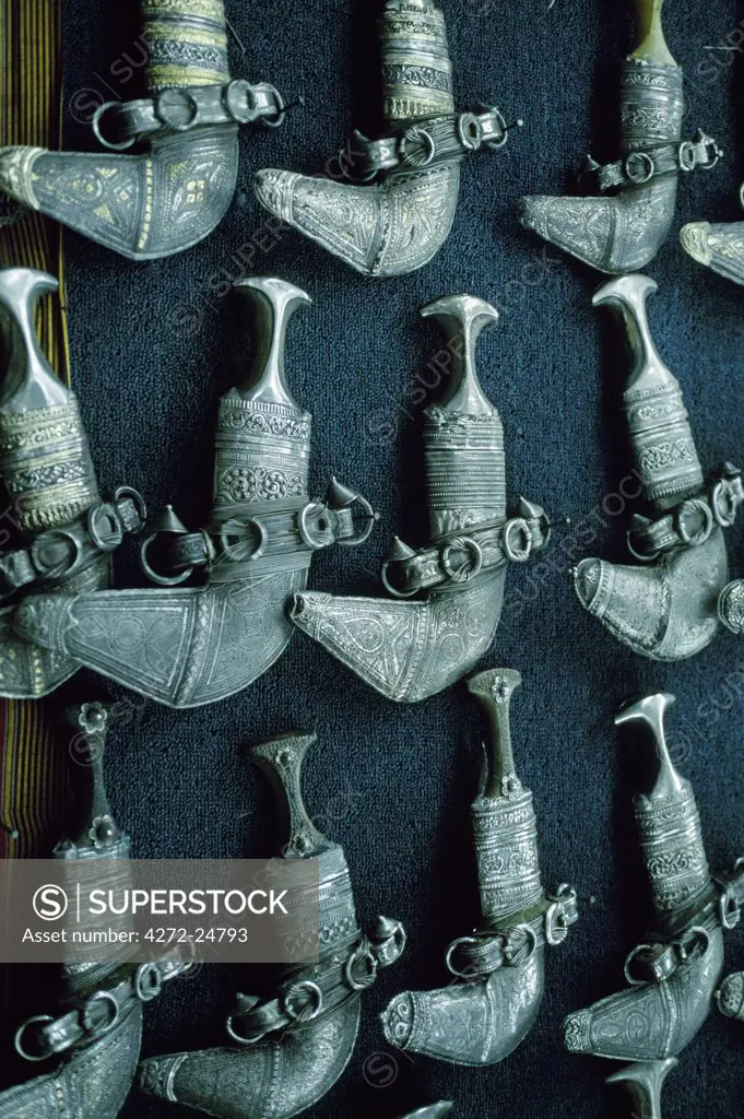 A display of silver khanjars, the curved ceremonial daggers worn by Omani men, in a shop in Muttrah souq