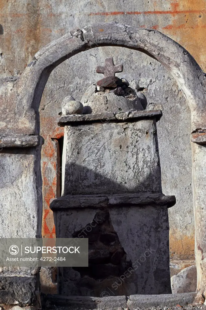 A small shrine at the entrance to the church at the site of the old village of Tahua on the northern shore of the Salar de Uyuni, the largest salt flat in the world.