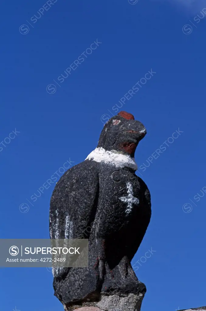 A carved stone condor stands on the gatepost of the main church at the small village of Tahua on the northern shore of the Salar de Uyuni, the world's largest salt flat.   In many Andean communities the religion is a blend of Catholicism with ancient animistic beliefs.