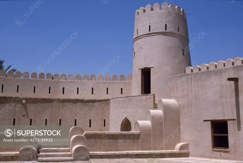 Architectural details of the crenellated walls, tower and buttresses inside the castle at Jaalan Bani bu Hasan