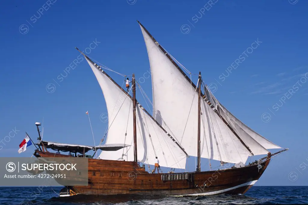 S/Y Sanjeeda, a traditional kotiya dhow of the type that traded  throughout the Indian Ocean, sailing off Mirbat on the Dhofari coast of Oman