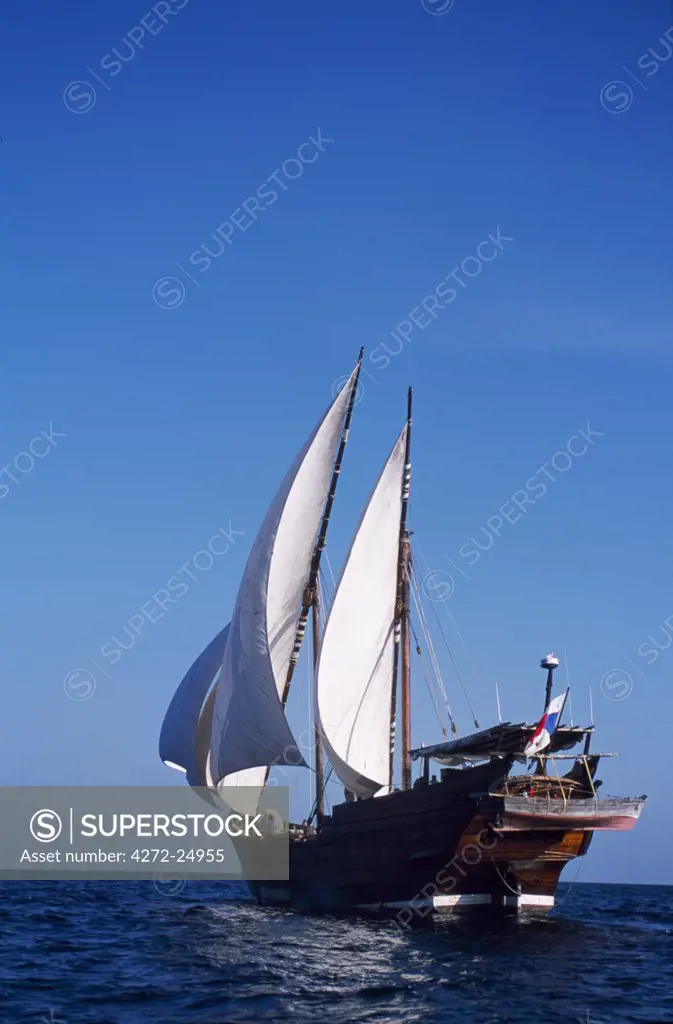 S/Y Sanjeeda, a traditional kotiya dhow of the type that traded  throughout the Indian Ocean, sailing off Mirbat on the Dhofari coast of Oman