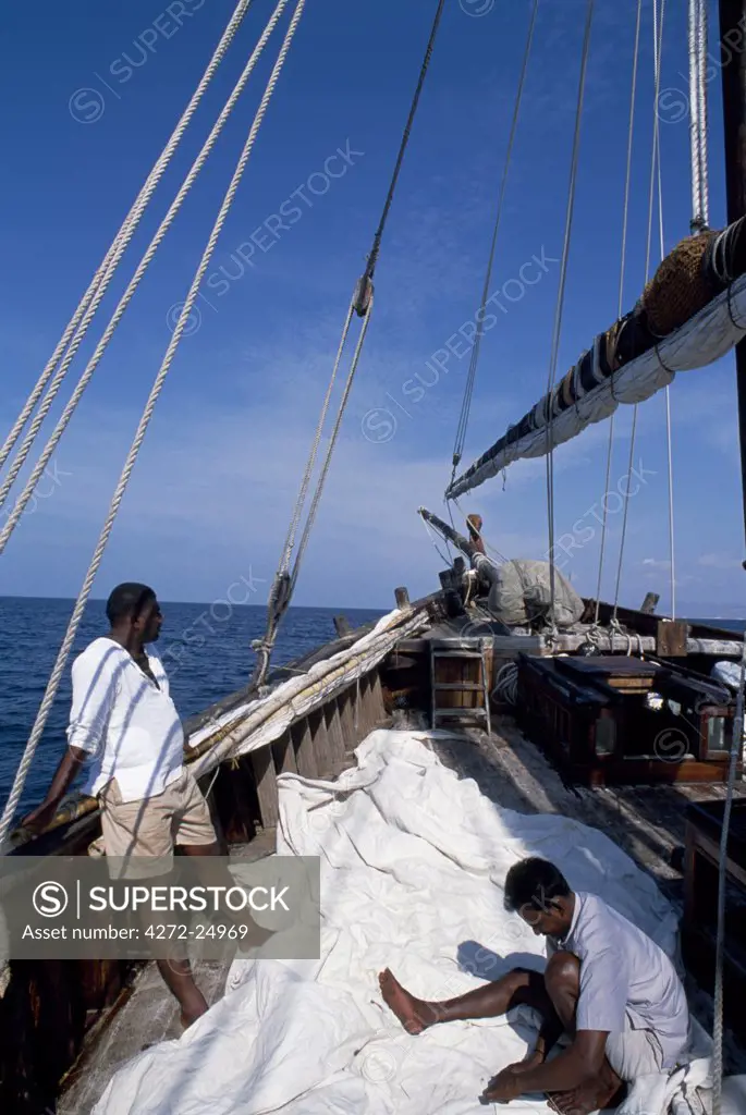 Crew members repair the sails of S/Y Sanjeeda.  Sanjeeda is a traditional kotiya dhow of the type that traded throughout the Indian Ocean.