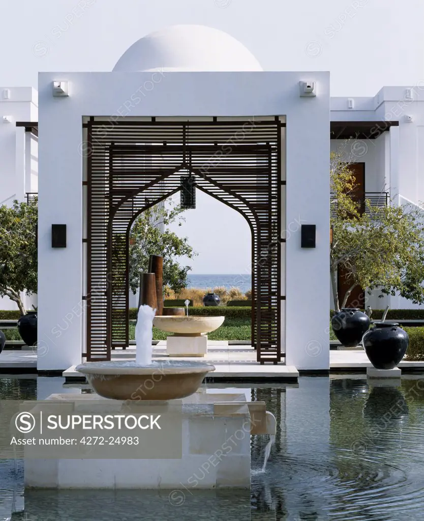 Contemporary architecture with an Omani theme blends crisp white lines, arches and domes at the water garden at the Chedi Hotel