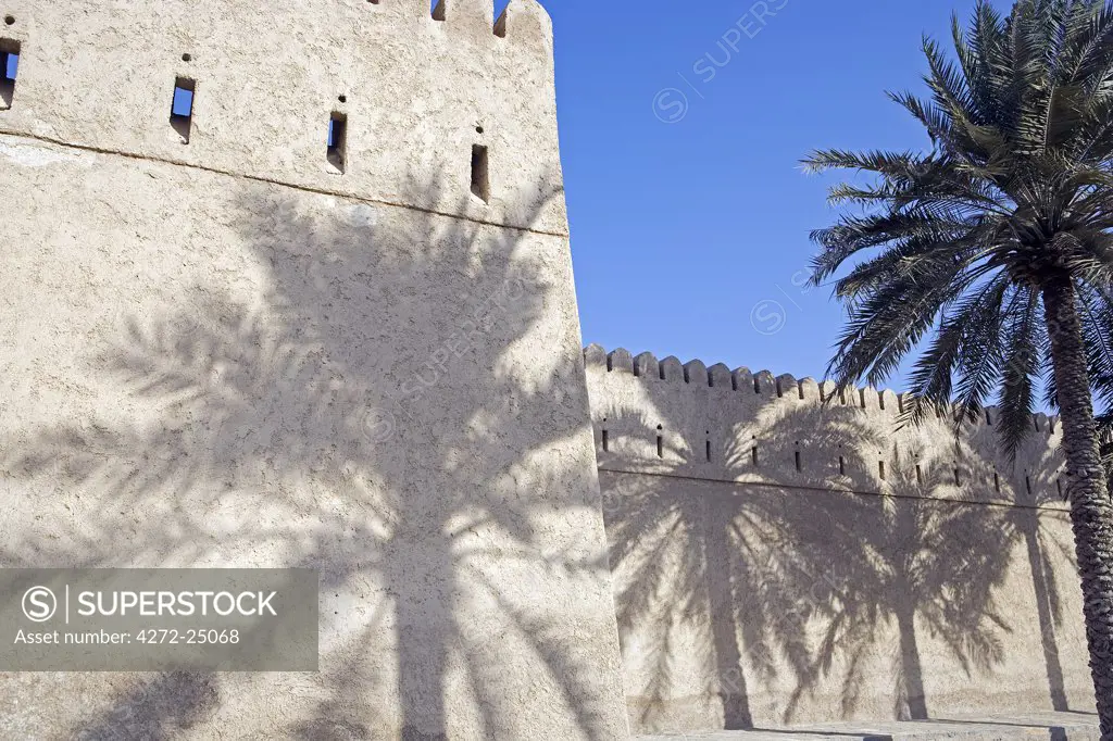 Oman, Musandam Peninsula, Khasab.  A traditional mud built fort overlooking the bay to the front of the small town of Khasab famous for fishing and smuggling in small, fast boats, to and from Iran.