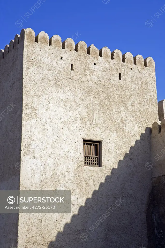 Oman, Musandam Peninsula, Khasab.  A traditional mud built fort overlooking the bay to the front of the small town of Khasab famous for fishing and smuggling in small, fast boats, to and from Iran.