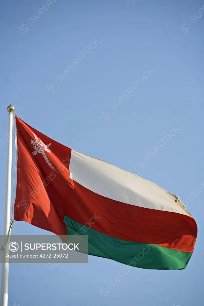Oman. The National Flag - this flag contains the country's national coat of arms which is a khanjar dagger in a sheath that is superimposed upon two crossed swords. This is the traditional symbol of Oman. It is found on numerous flags as well as the currency of Oman.