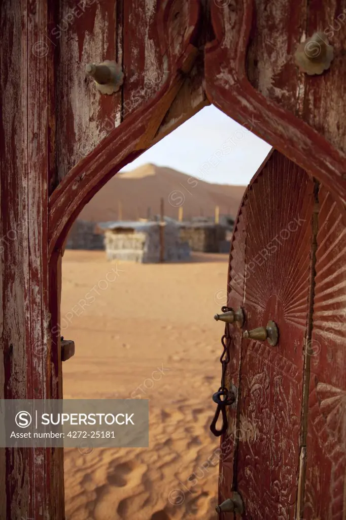 Oman, Wahiba Sands. The door leading into the Nomadic Desert Camp.