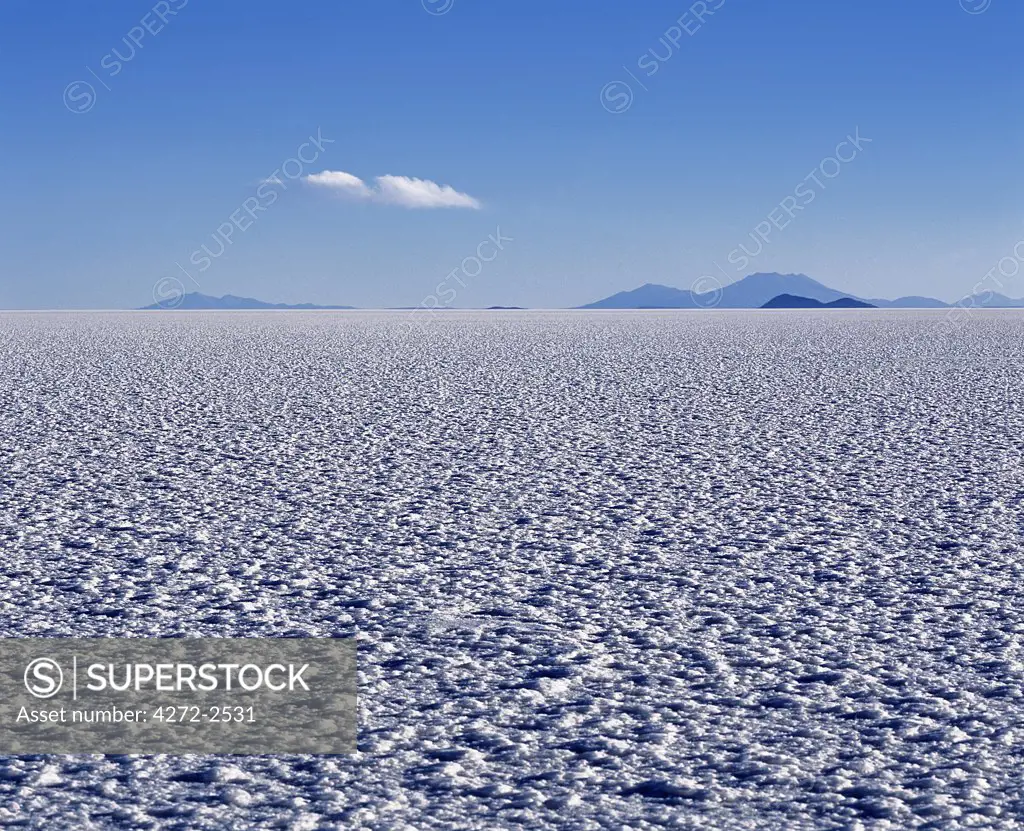 The endless salt crust  of the Salar de Uyuni, the largest salt flat in the world at over 12,000  square kilometres.