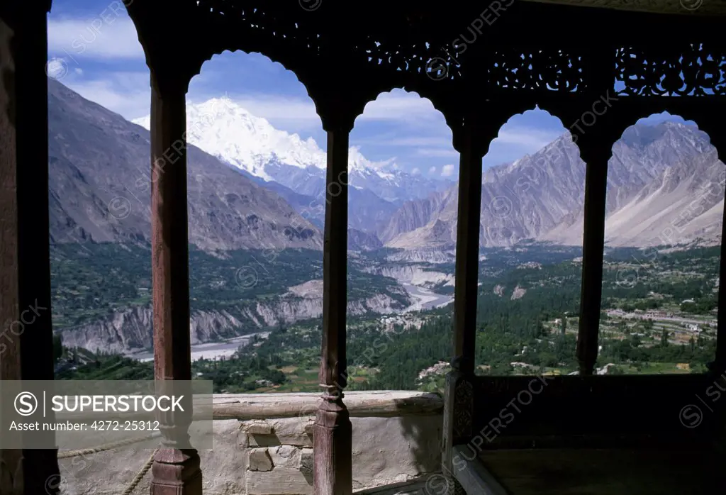 Northwest Pakistan. The Hunza Valley facing south from the Baltit Fort along the Hunza River. The Peak of Rakaposhi in the Karakorums is visible in the distance
