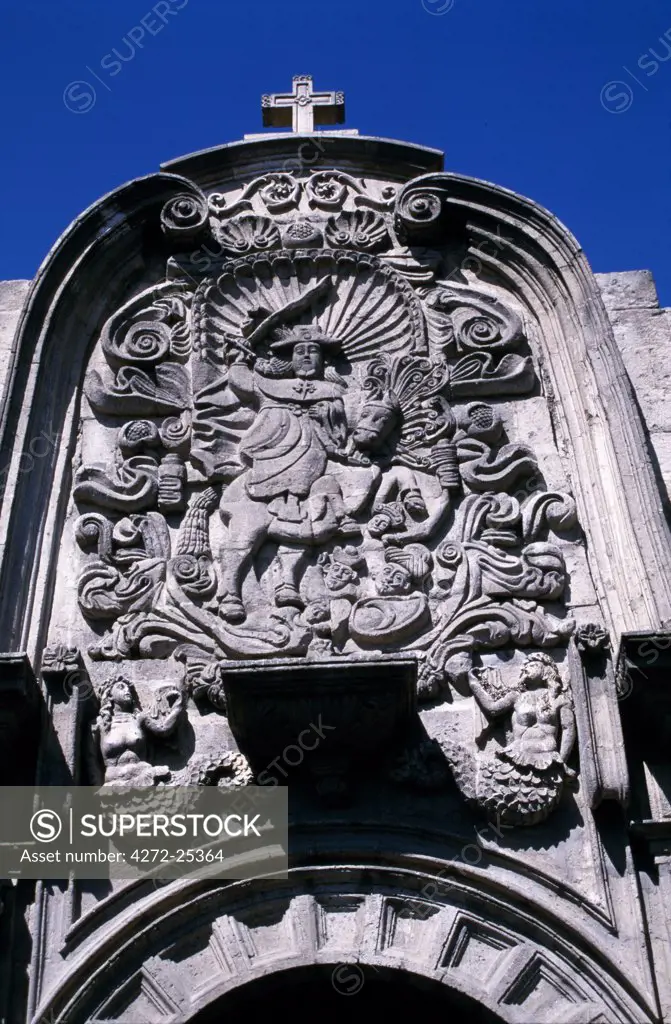 Detail of frieze over side of portal at La Compania church