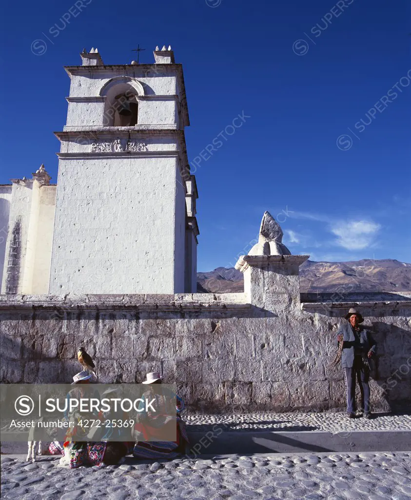 Quechua family outside Sibayo village church