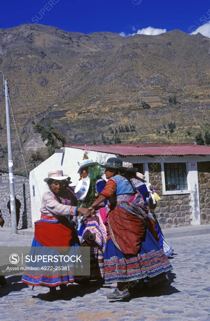 Quechua women dancing to mark the Annual Fiesta of San Joaquin.