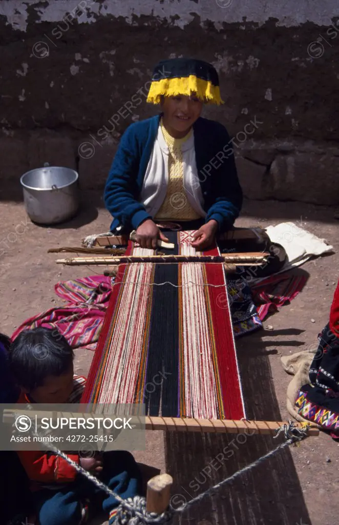 Women weaving textiles at Pisac Market
