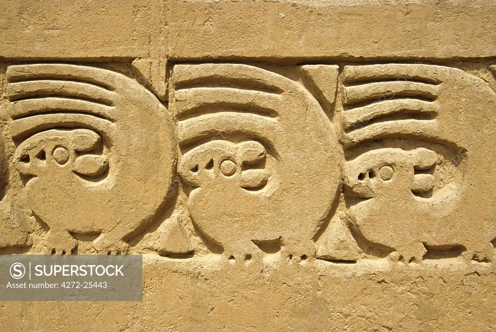 Adobe wall frieze incorporating sea otter and wave design in the Ceremonial Courtyard of the Tschudi Complex, at Chan Chan. Built around 1300 AD and covering 28 square km, Chan Chan is the largest pre-columbian city in the Americas and largest adobe settlement in the world.
