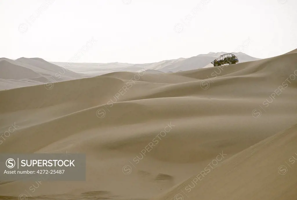 A tourist dune buggy looks out across the sand dunes near Huacachina, in southern Peru.