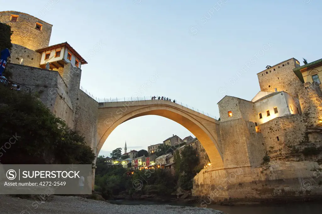Mostar, Stari Most Peace Bridge on Neretva River lit up in the evening Replica of 16th Century Stone Bridge Destroyed by Croat Shelling in 1993 and Newly Opened in 2004