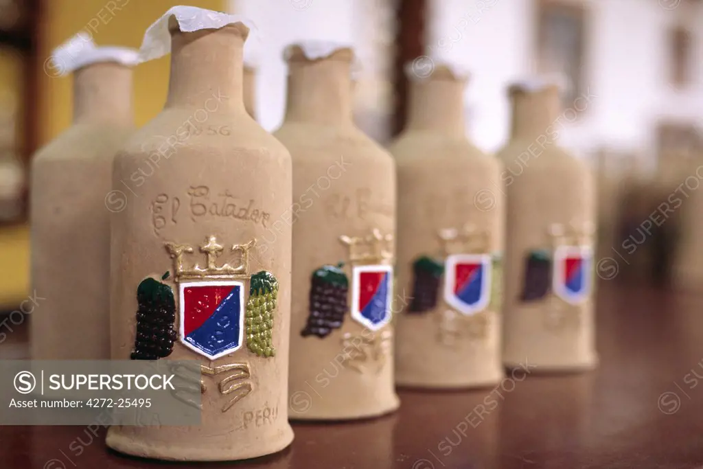 Decorative bottles of Pisco Sour at a bodega (vineyard) on the outskirts of Ica, in southern Peru. Pisco Sour, a white-grape brandy, is the Peruvian national drink.