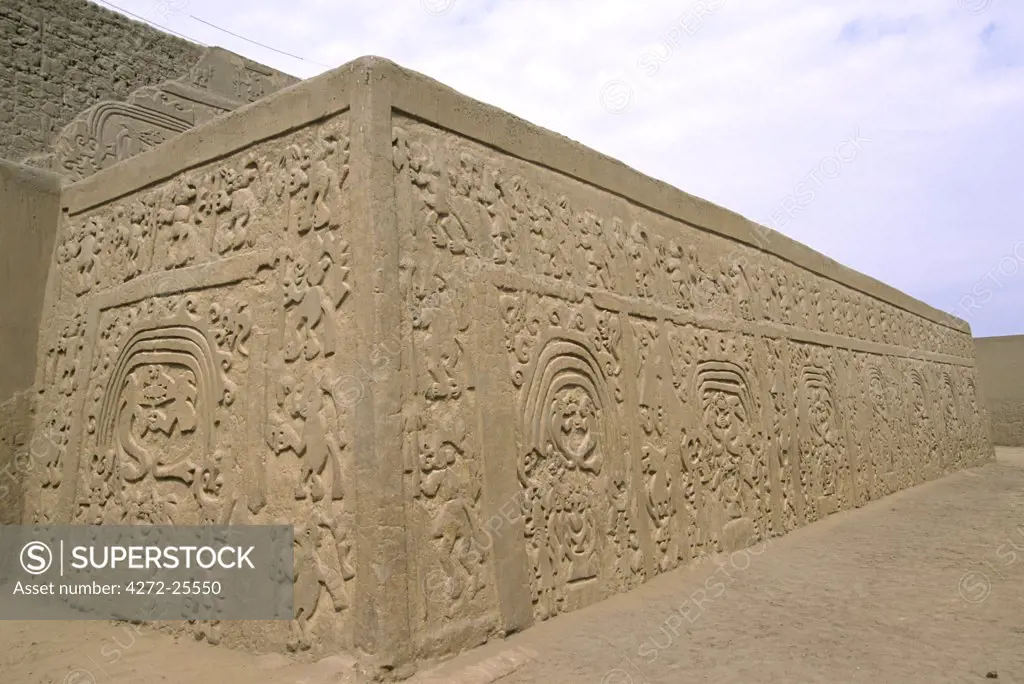 The pyramidal, adobe walls of the Huaca Arco Iris (Rainbow Temple) decorated with elaborate relief carvings. The temple is from the Chimu empire - lasting from about AD 850 to 1470.