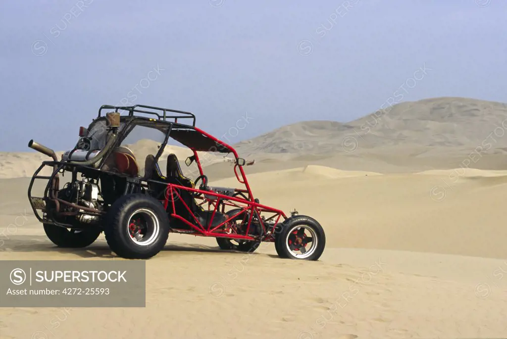 A dune buggy sits in the desert expense of Peru's coastal desert near Ica in southern Peru