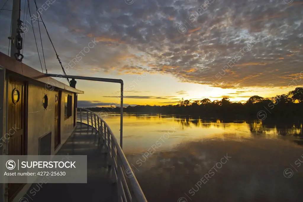 Peru, Amazon River. Sunrise on the Ayapua Riverboat, Yavari River, a tributary of the Amazon River.