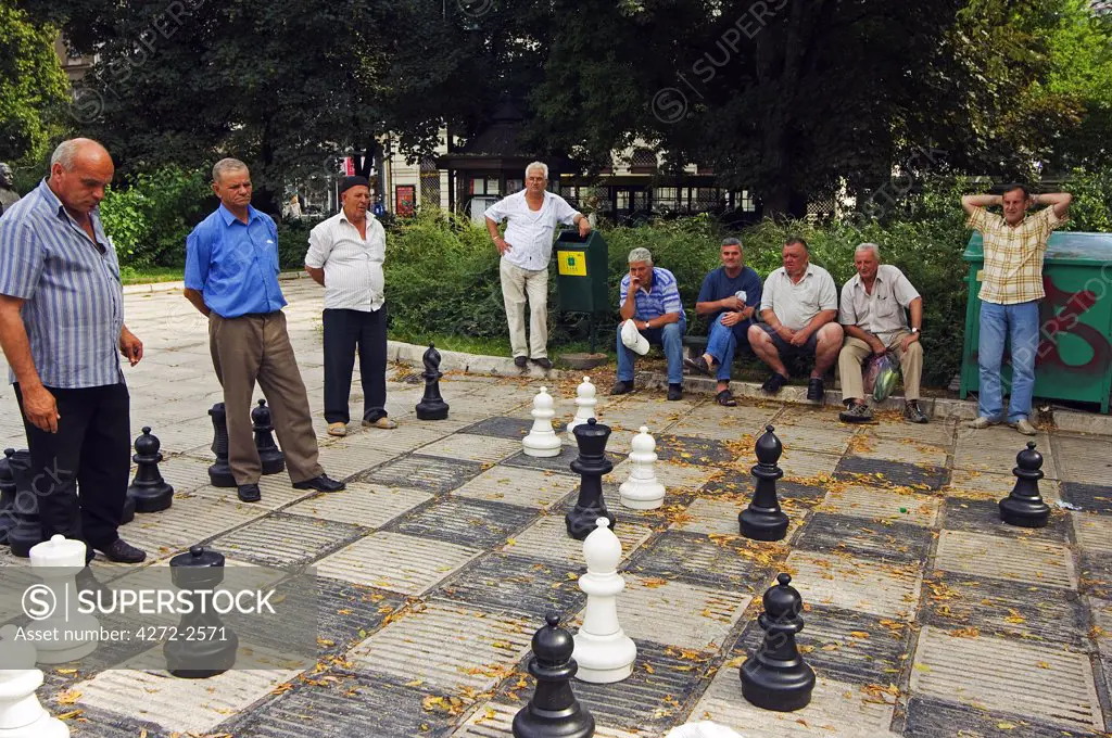 Local Men Playing Chess in the Park