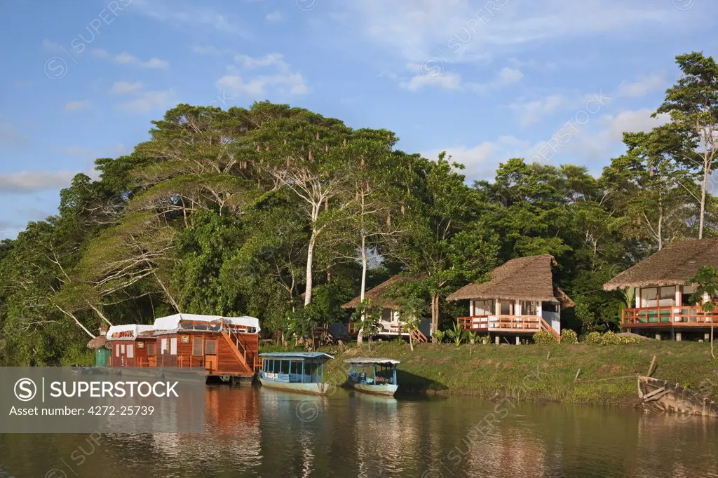 Peru. A tourist Lodge and two houseboats on the banks of the Madre de Dios River.