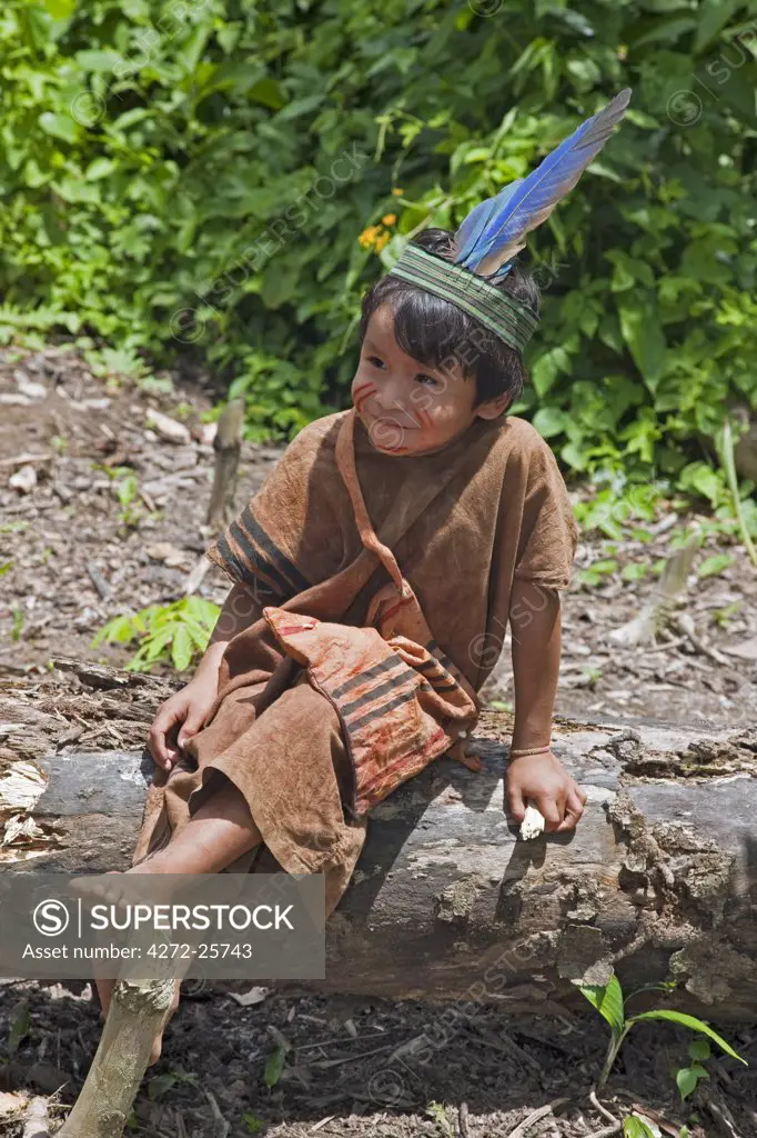 Peru. A Matsigenka boy wearing clothes made from homespun cloth. The small Matsigenka Indian tribe inhabit the upper Amazon.