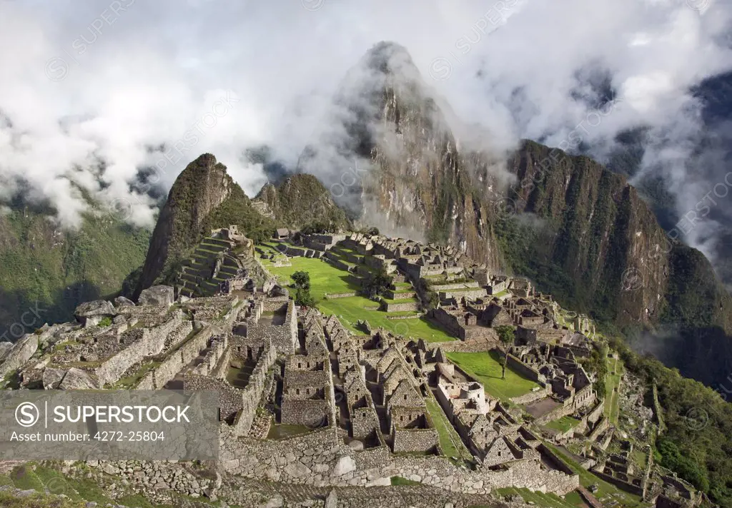 Peru, The world-famous Inca ruins at Machu Picchu at an altitude of 7,710 feet above sea level with the peak, Huayna Picchu.