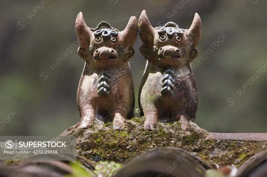 Peru, Clay bulls are common rooftop ornaments throughout Peru. Said to bring good luck and protect from evil spirits.