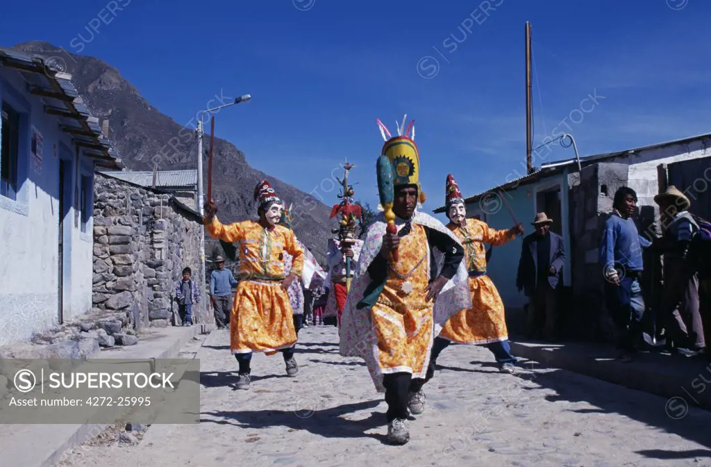 Peru, Colca Canyon, Maca. Costumed Quechua dancers (Inca worriors leads Turks) the Annual Fiesta of San Joaquin, Maca, Colca Canyon.