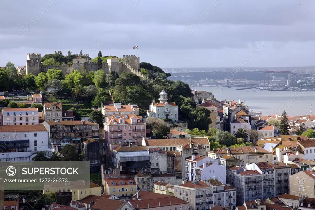 Portugal, Lisbon. The Castelo Sao Jorge in Lisbon with the Rio Tejo in the background.