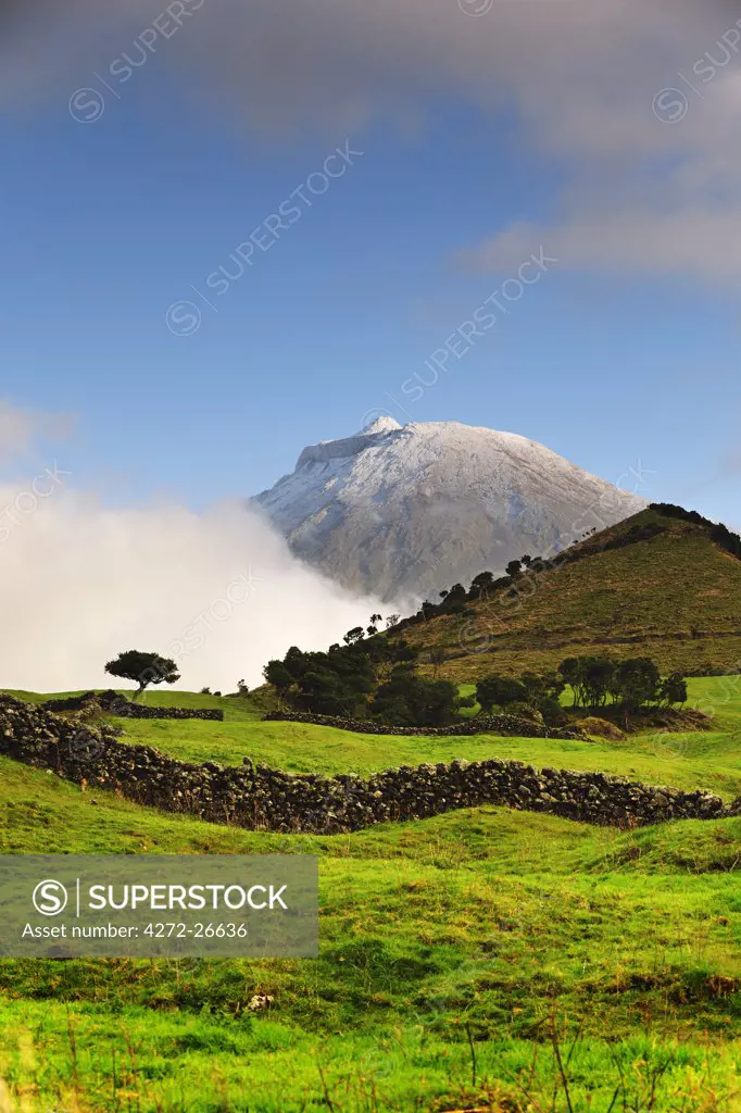 The volcano covered with snow, 2351 meters high, at the Pico island. His last eruption was in 1720. Azores islands, Portugal