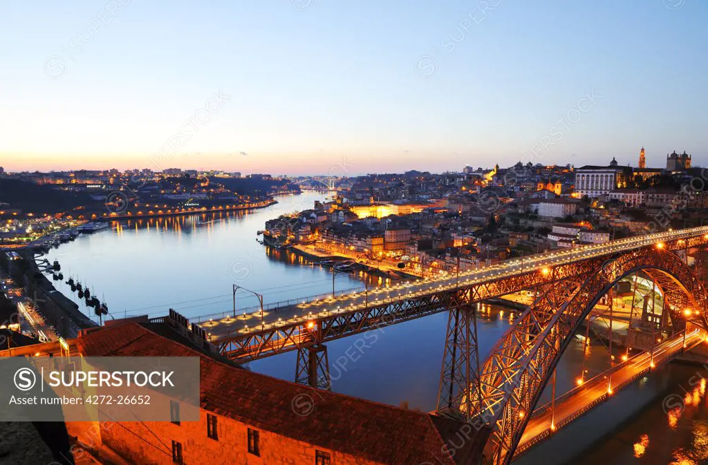 Oporto, capital of the Port wine, with the Douro river and Dom Luis bridge at sunset, Portugal