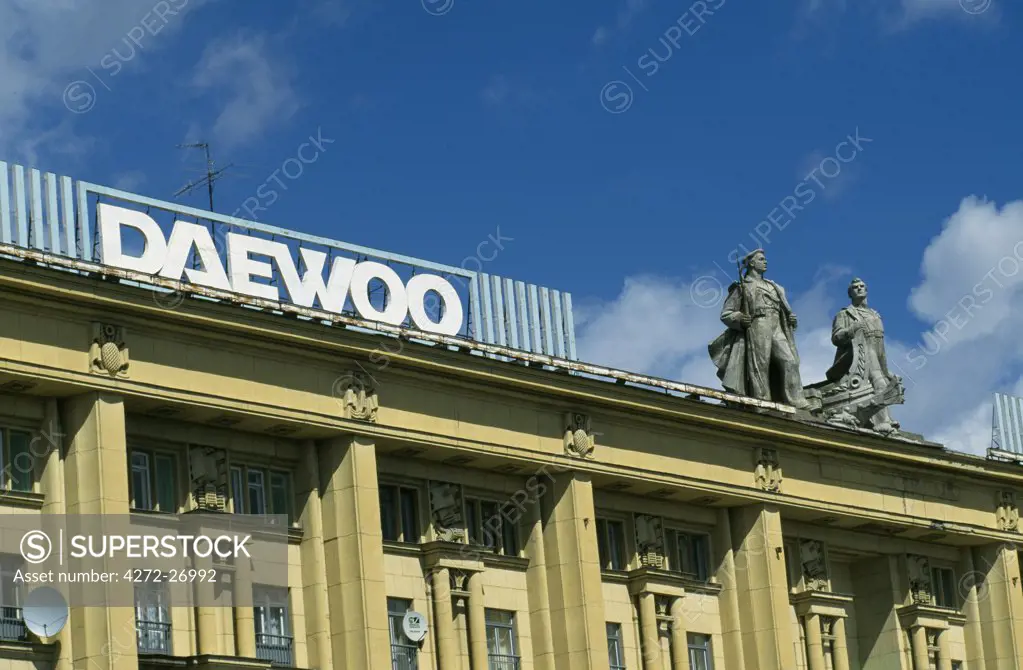 Daewoo sign and Russian heroes atop building.