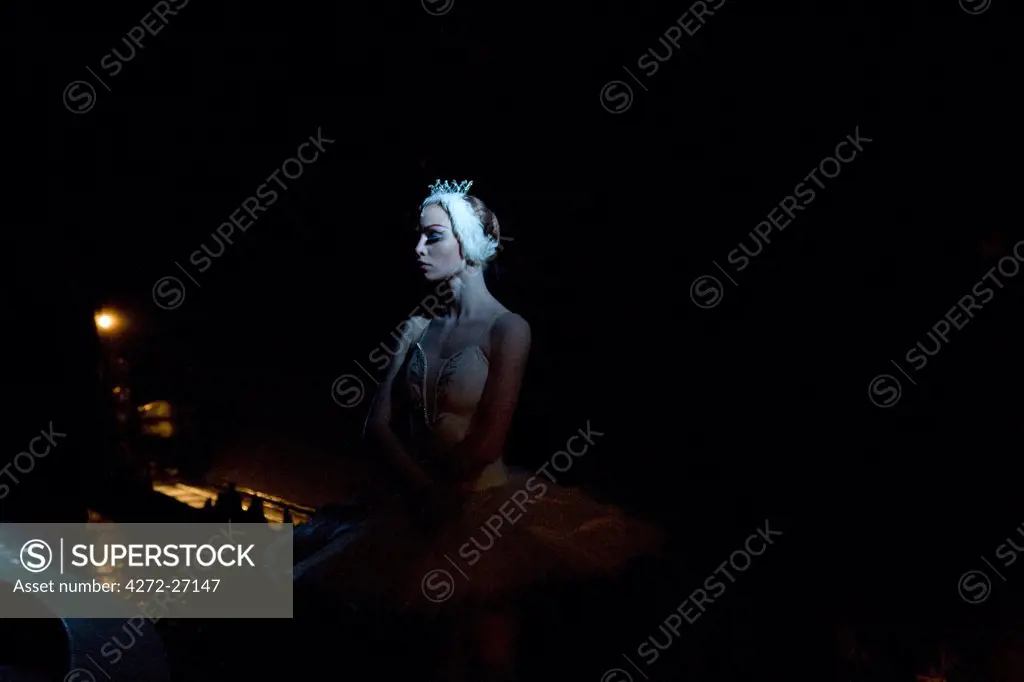 Russia, St.Petersburg; A ballet dancer, playing the lead Swan Odette in 'Swan Lake' moments before the performance