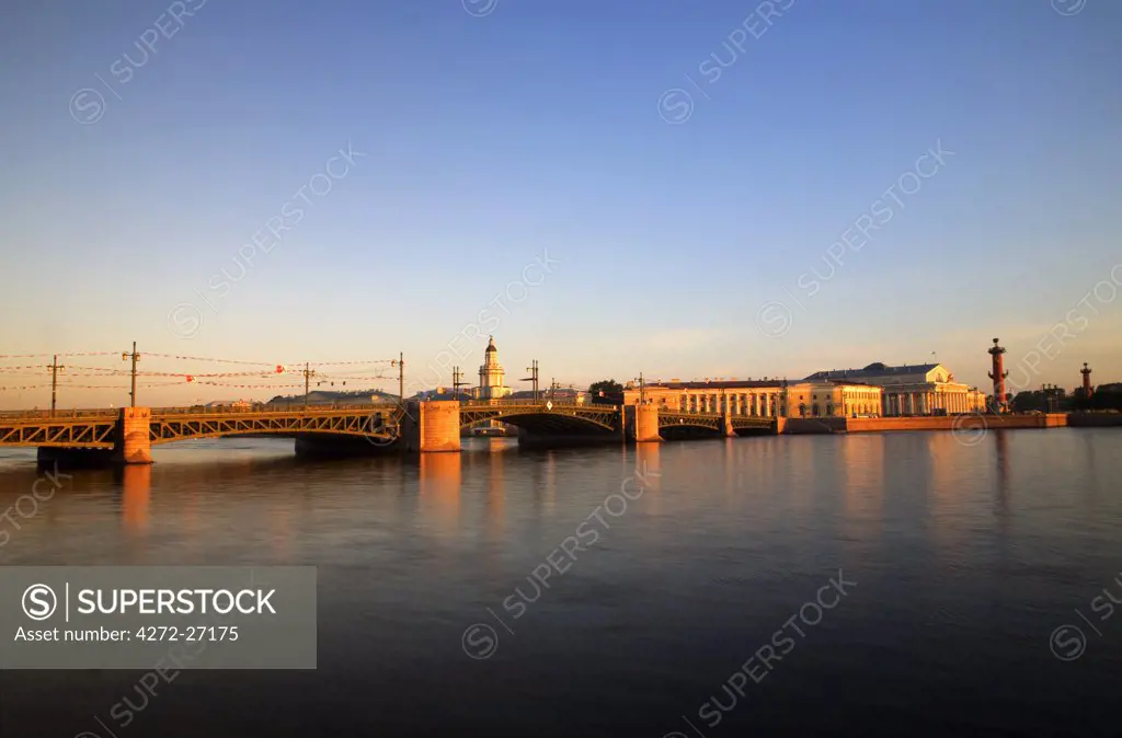 Russia, St.Petersburg; Across the Neva River with the Maritime Museum and Rostral Columns in the background.