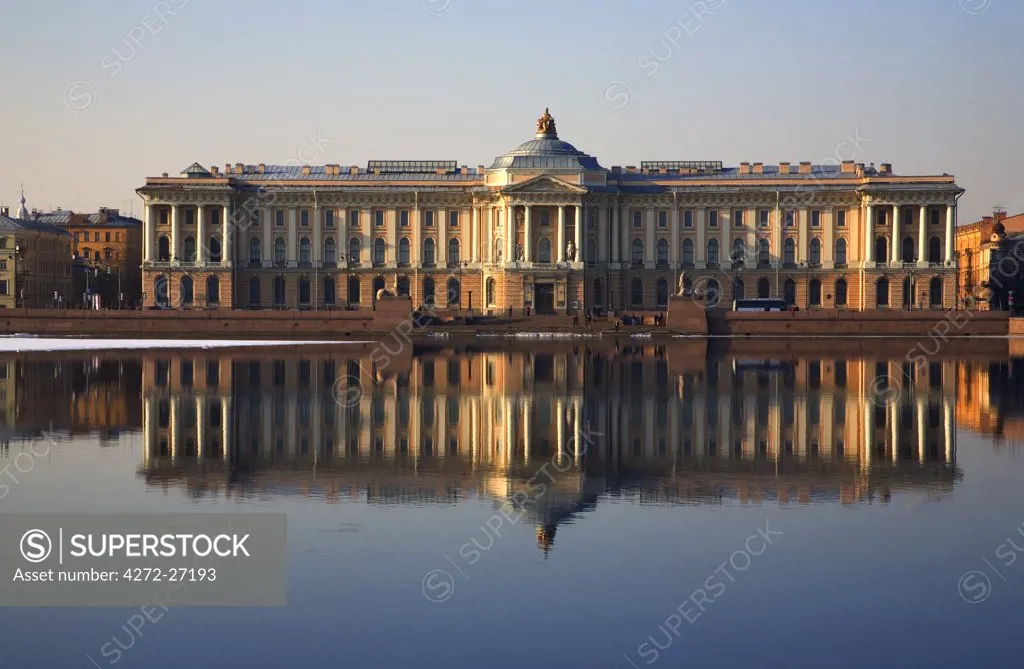 Russia, St.Peterburg; The majestic St.Petersburg Art Academy reflected on the Neva river. With the Sphinxes brought from Egypt.