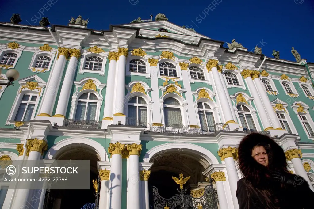 Russia, St. Petersburg; People standing in front of the State Hermitage Museum, designed by Bartolomeo Rastrelli