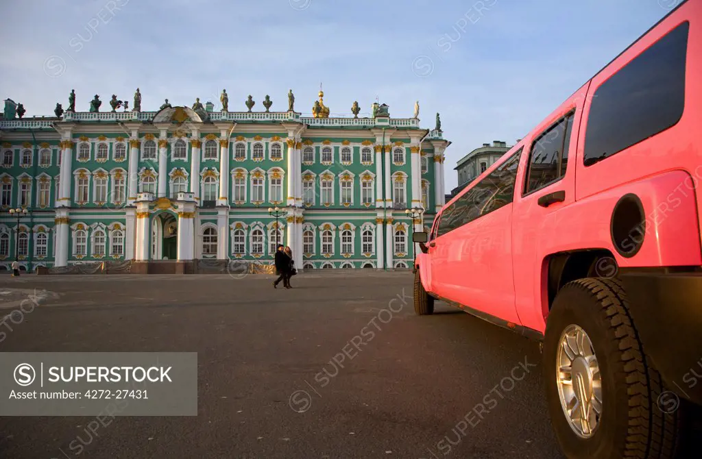 Russia, St. Petersburg; A brightly coloured car parked outside the State Hermitage Museum