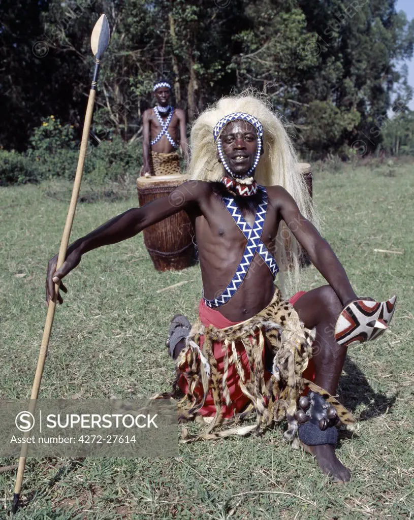 An Intore dancer performs at Butare. Many years ago, his sisal headdress would have been a lion's mane.In the days of the monarchy in Rwanda, Intore dancers were an integral part of the Royal Court. Today, several groups perform nationally and internationally. Their rhythm, movement and impressive drumming is widely acclaimed.
