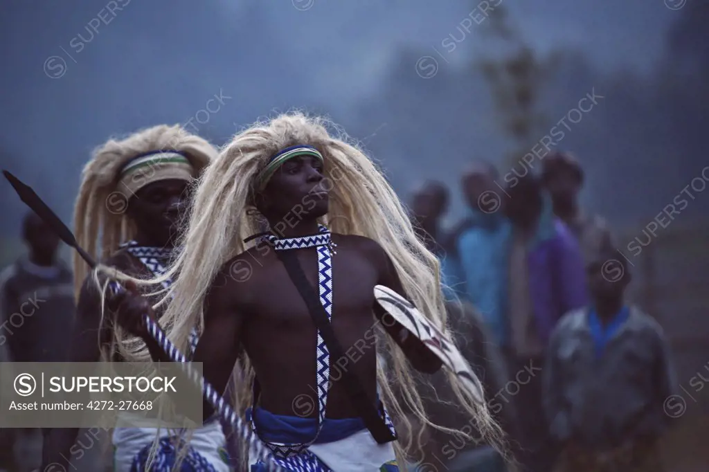 Virunga, Rwanda. Traditional Intore dancers perform at the foot of the Volcanoes National Park.