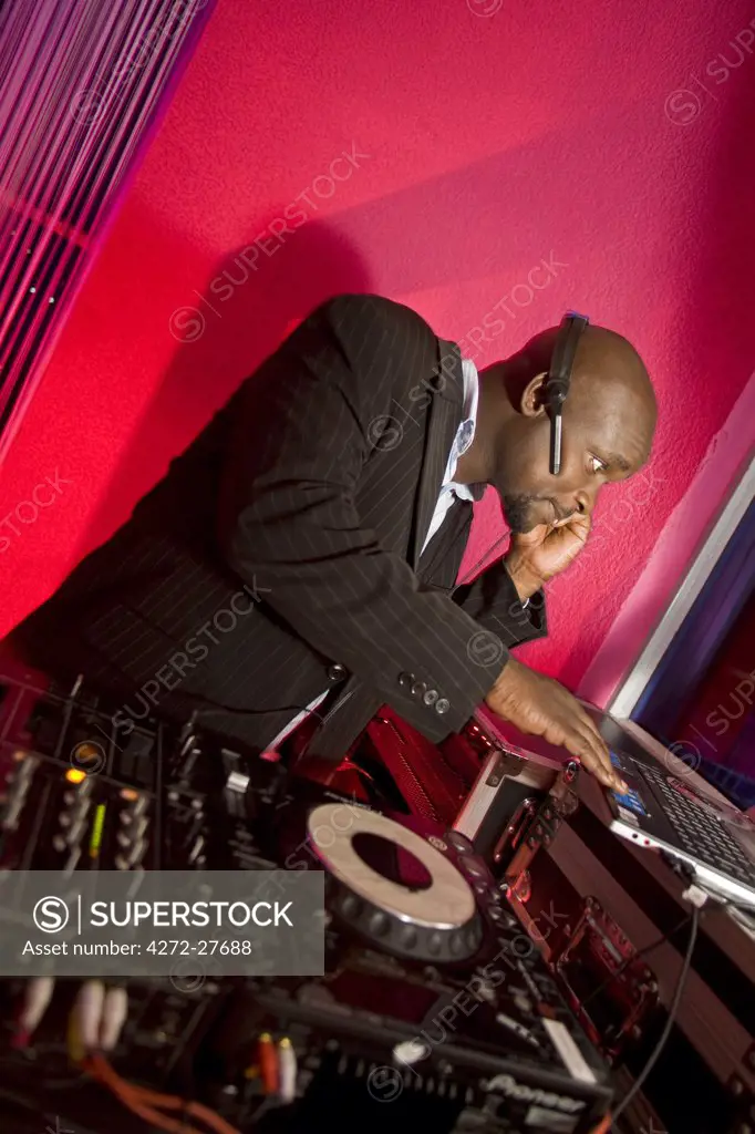 Kigali, Rwanda. A DJ entertains at a local nightclub. (MR).
