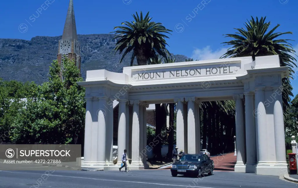 A limousine leaves the entrance to Mount Nelson Hotel