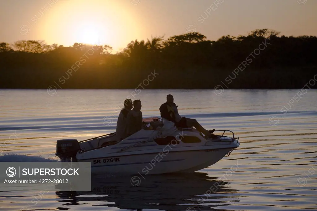 A speed boat on the St Lucia Estuary, part of the Greater St Lucia Wetlands Park. The park has recently been renamed the iSimangaliso Wetland Park.