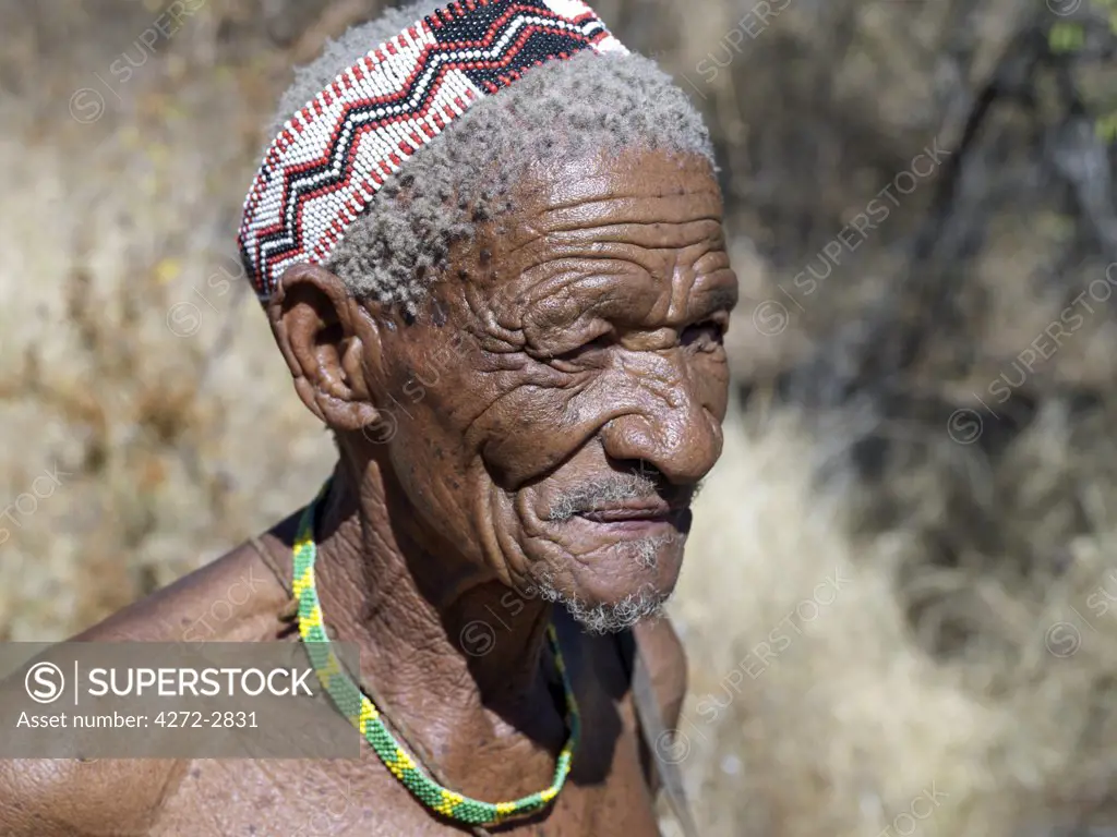 A wizened old NS hunter gatherer. The NS are a part of the San people, often referred to as Bushmen. The NS live in the harsh environment of a vast expanse of flat sand and bush scrub country straddling the Namibia Botswana border.