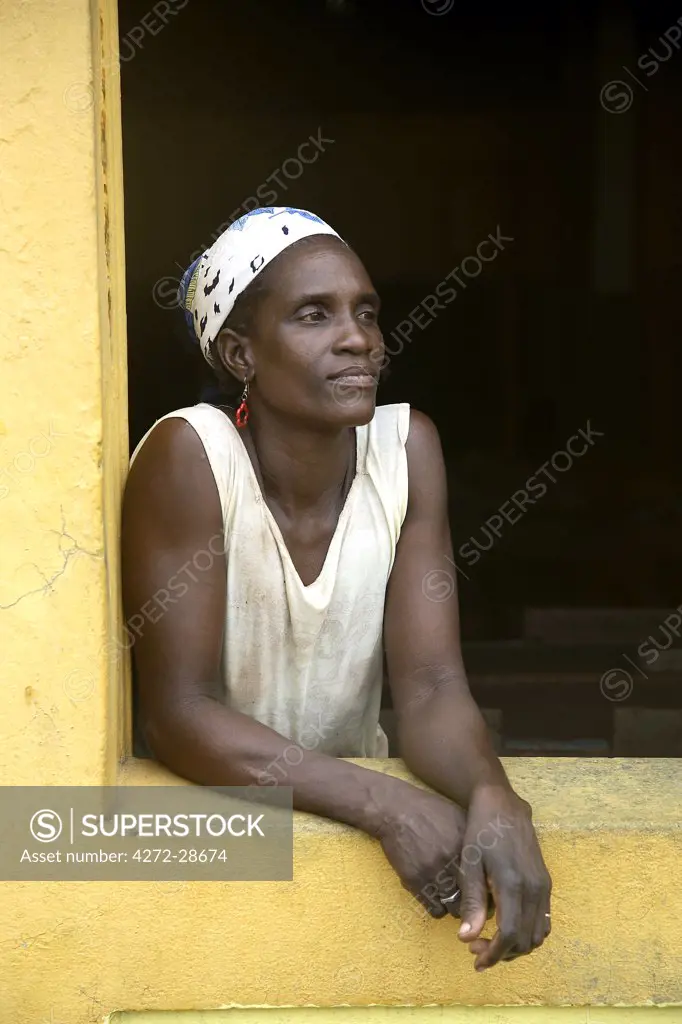 A Sao Tomense woman at the cocoa plant where she works in the small village of Agua Ize in Sao Tome and Principe. Sao Tome and Principe is Africa's second smallest country with a population of 193 000. It consists of two mountainous islands in the Gulf of New Guinea, straddling the equator, west of Gabon.