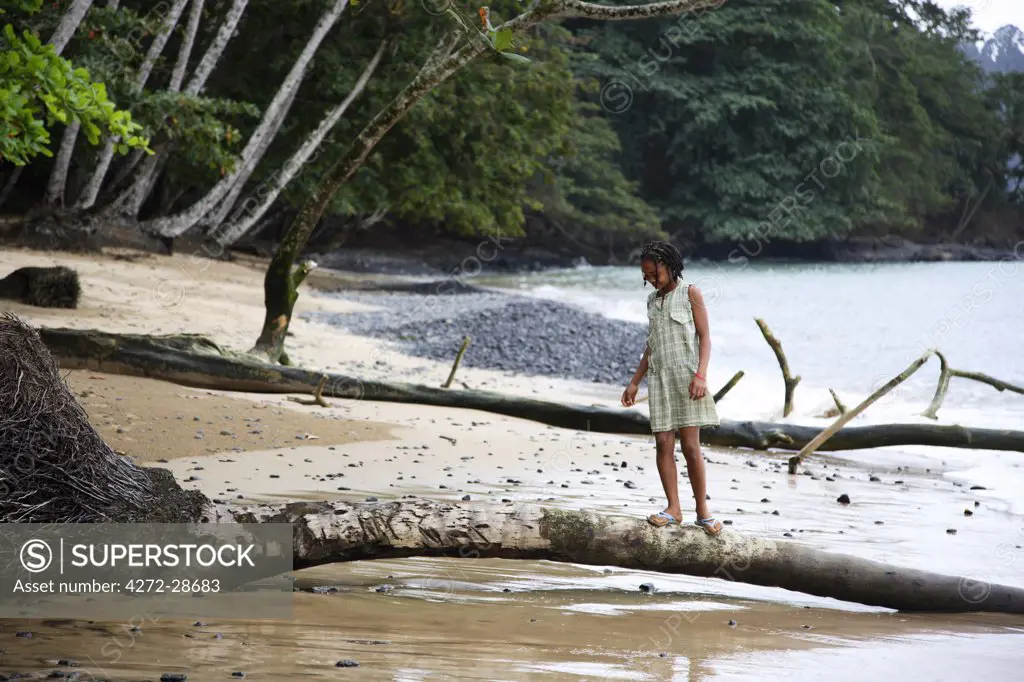 A young girl plays on Praia Evora (beach Evora) just south of Santa Antonio on the island of Princip_. Sao Tom_ and Princip_ is Africa's second smallest country with a population of 193 000. It consists of two mountainous islands in the Gulf of New Guinea, straddling the equator, west of Gabon. Princip_ is the smaller of the two islands with a population of around 5000.