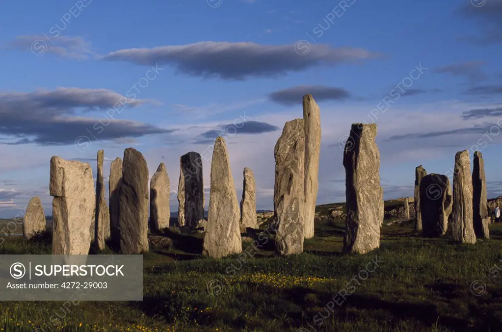 Sunset over the central circle at Callanish.  An ancient stone circle dating back to Neolithic times, Callanish is the most dramatic prehistoric site in the Hebrides and is sometimes referred to as the Stonehenge of Scotland